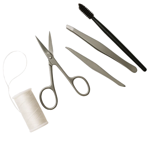 A pair of scissors, tweezers, a spool of white thread, and a brow brush arranged neatly on a white background.